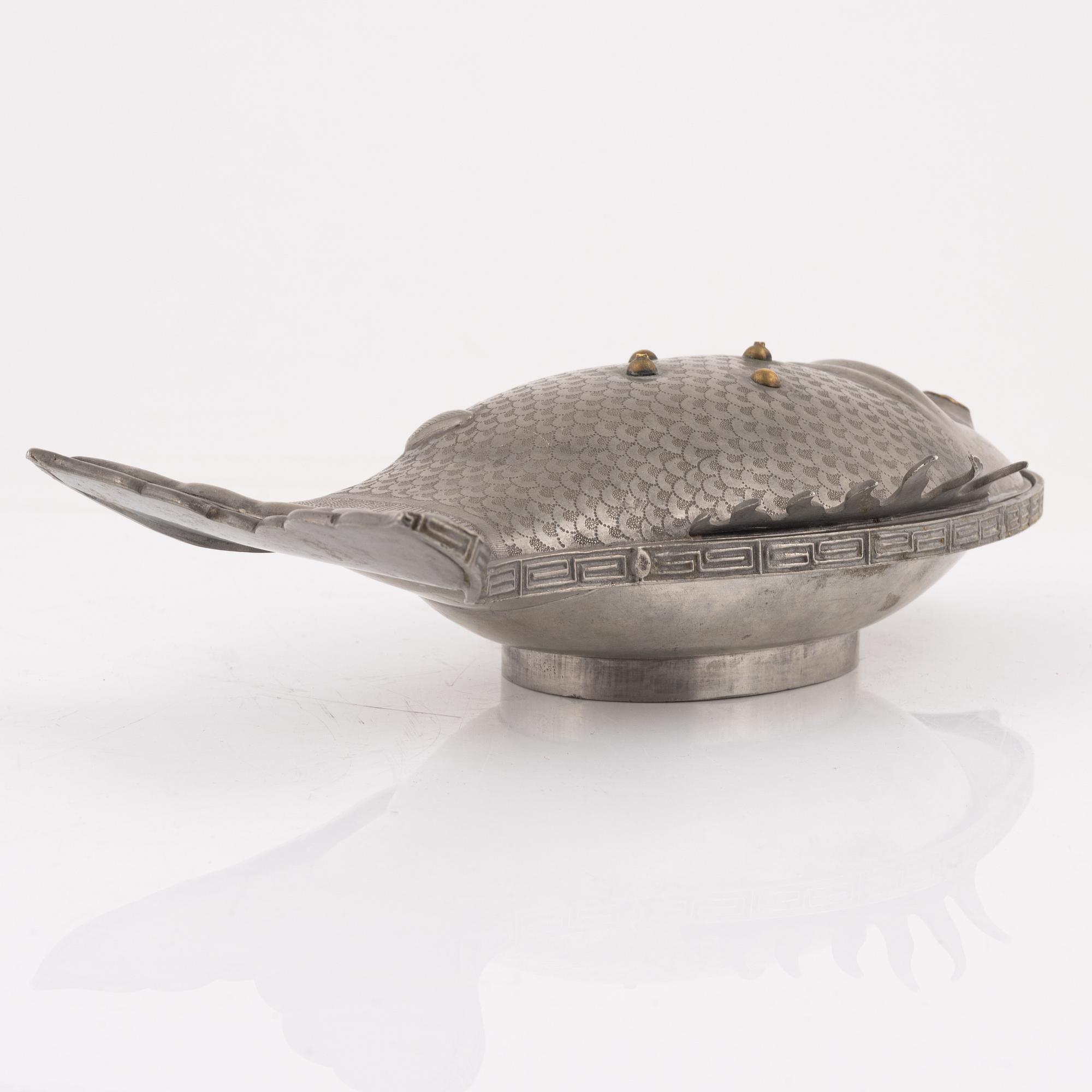A pewter jelly mould with lid.