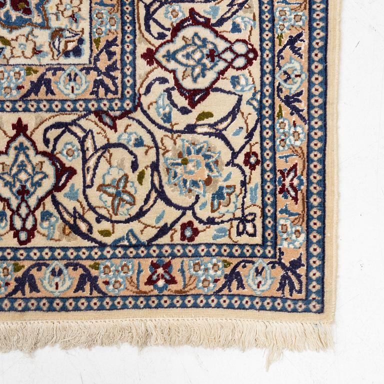 A Nain carpet, part silk, c 305 x 206 cm.