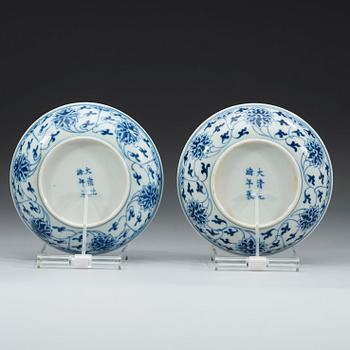 A pair of blue and white lotus dishes, Qing dynasty, Guangxu six character mark and period (1874-1908).