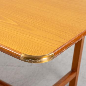 Josef Frank, an ash and brass lined desk/ table, Svenskt Tenn Sweden, model 590, post 1985.