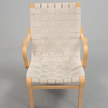 An "Mina" armchair by Bruno Matsson.