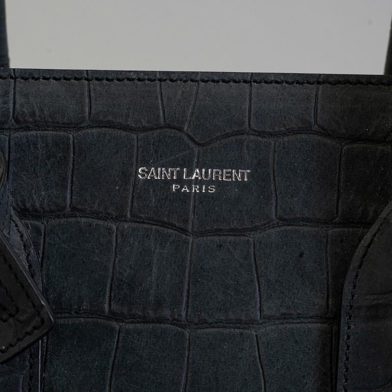 A bag by Yves Saint Laurent, "Sac du jour".