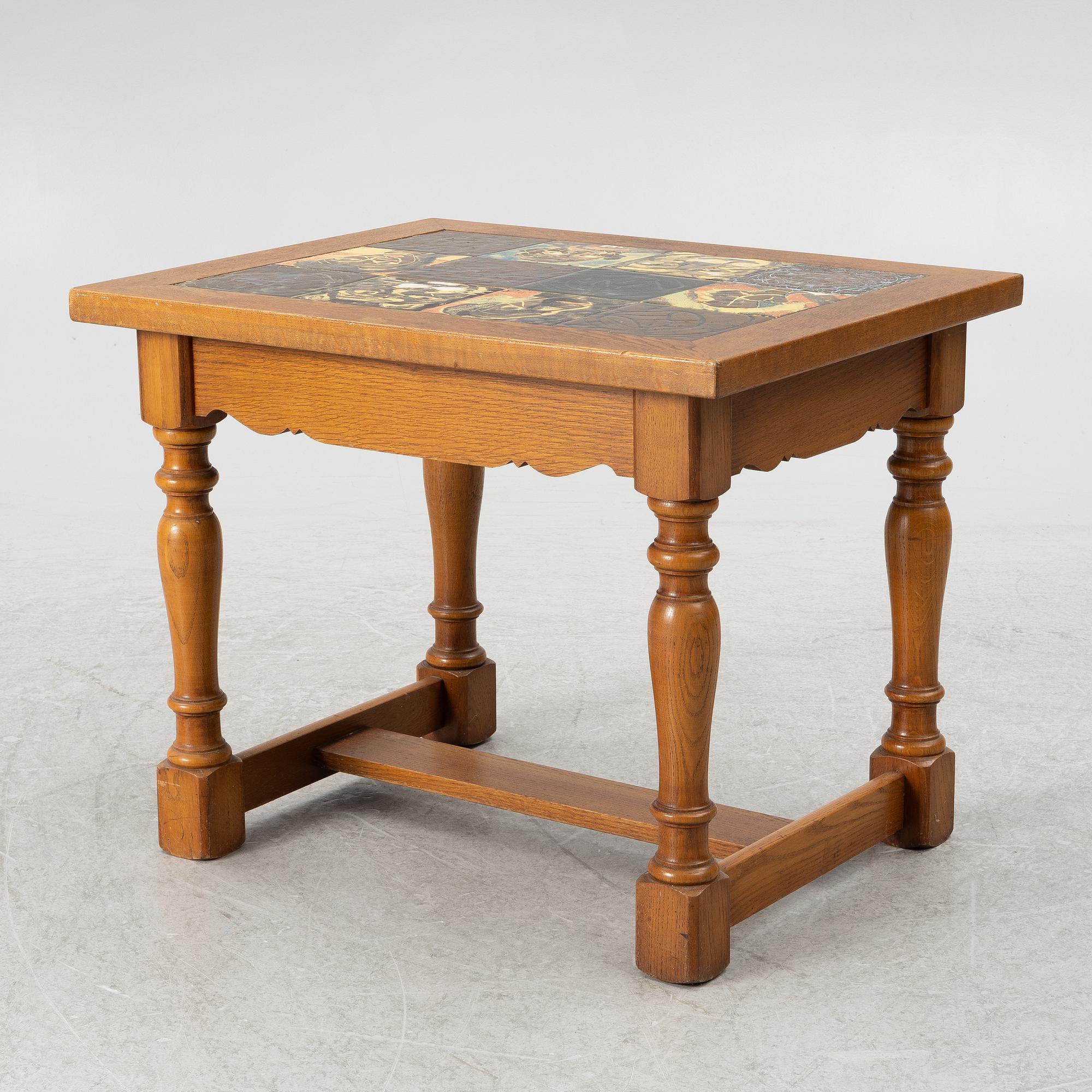 Allan Ebeling, table with various ceramic tiles, Torshälla, mid 1900s.