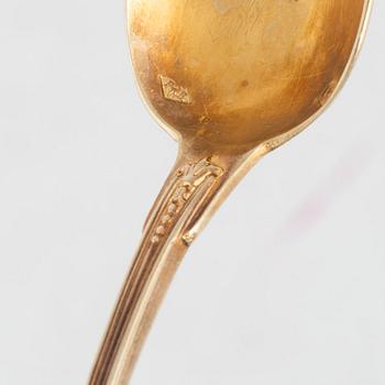 Philippe Berthier, 13 spoons, a sugar tongs and a tea strainer, gilded silver, Paris, France, 1841-51.