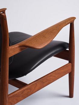 Finn Juhl, a teak and black leather 'model 136' easy chair, France & Daverkosen, Denmark 1950-60s.