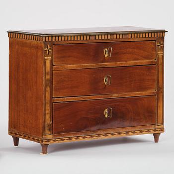 A Northern European mahogany miniature commode, early 19th century.