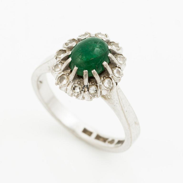 Ring, 18K white gold with cabochon-cut emerald and brilliant-cut diamonds.