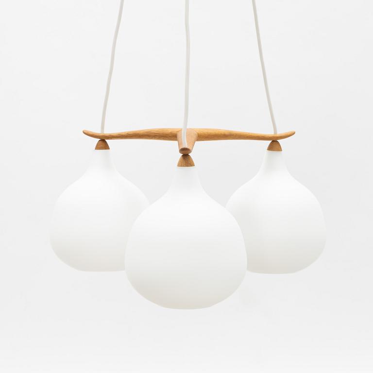 Uno & Östen Kristiansson, an oak and glass three-light ceiling lamp, Luxus, Vittsjö.