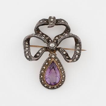 A pear cut amethyst, old cut diamond and rose cut diamond brooch.