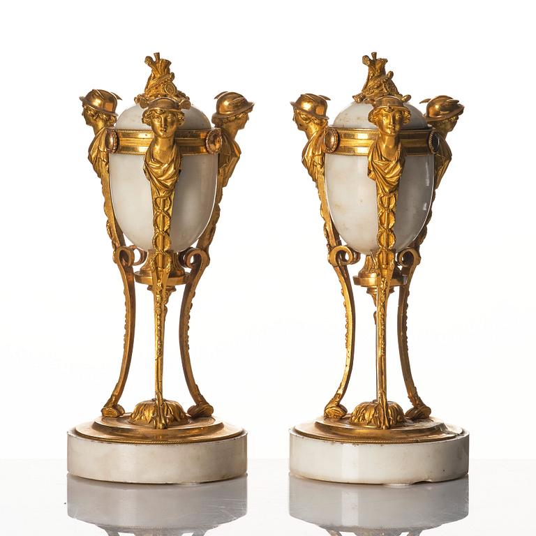 A pair of Louis XVI Cassolettes, white marble and gilt-bronze, around 1790.