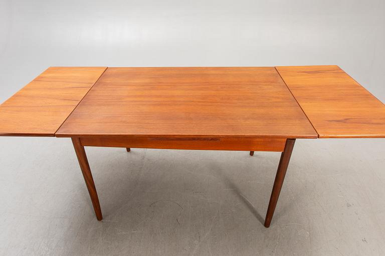 A Danish 1960s teak dining table.