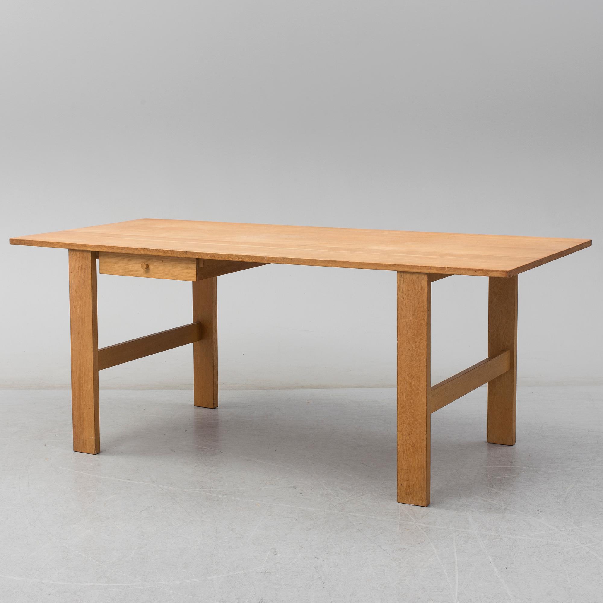 A second half of the 20th century oak table, 'Fogar', by John Kandell.