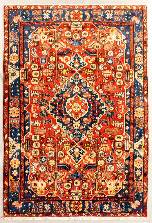 Oriental semi-antique rug, approximately 302x197 cm.