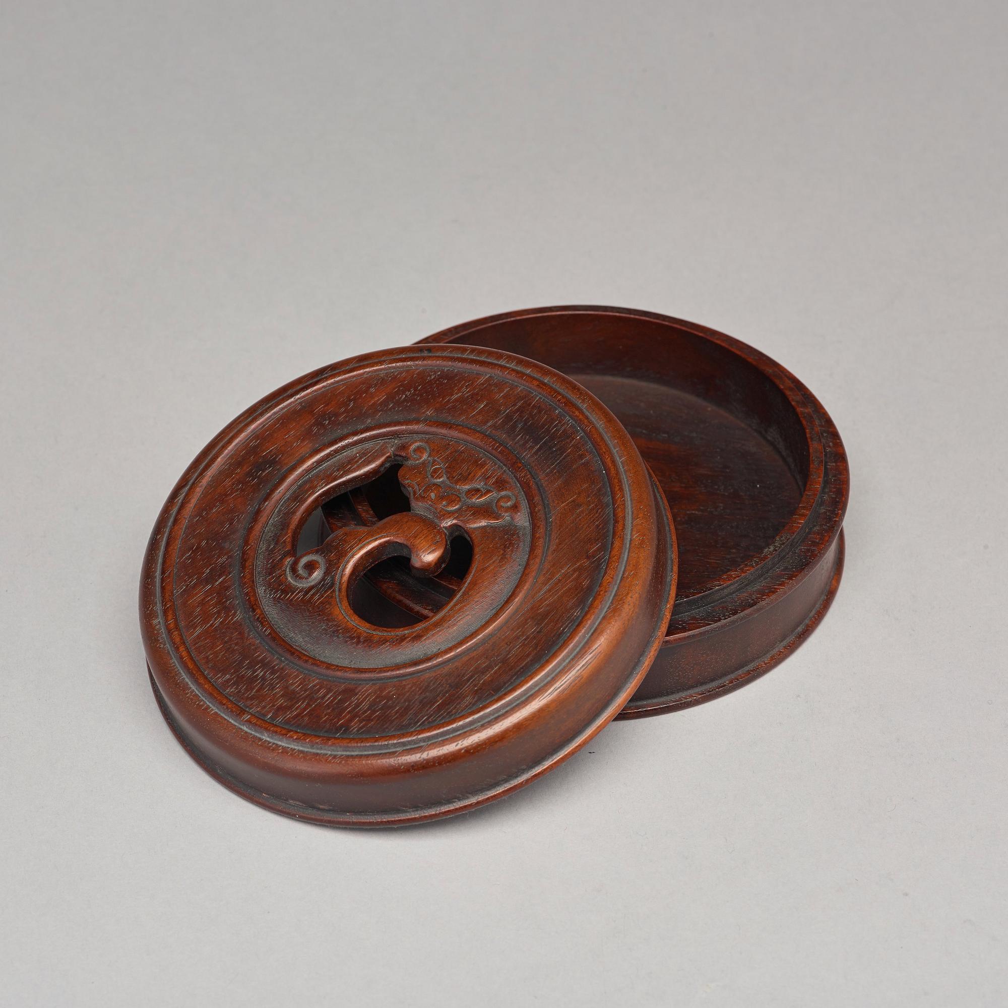 A Chinese wooden box with cover.
