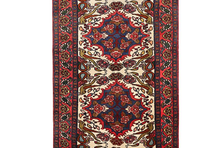 An oriental runner carpet, c. 295 x 95 cm.