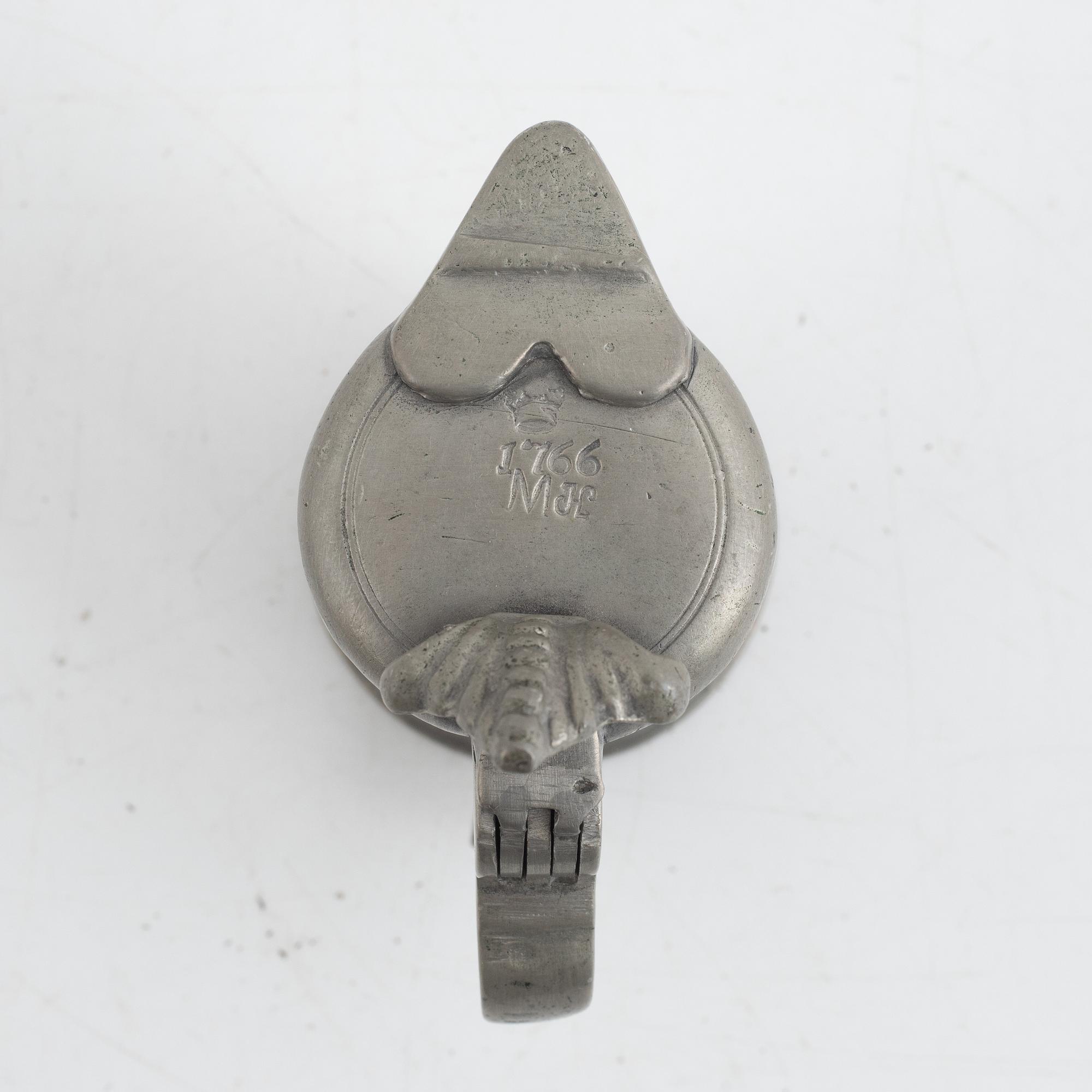 A pewter measuring cup by an unidentified master, dated 1766.