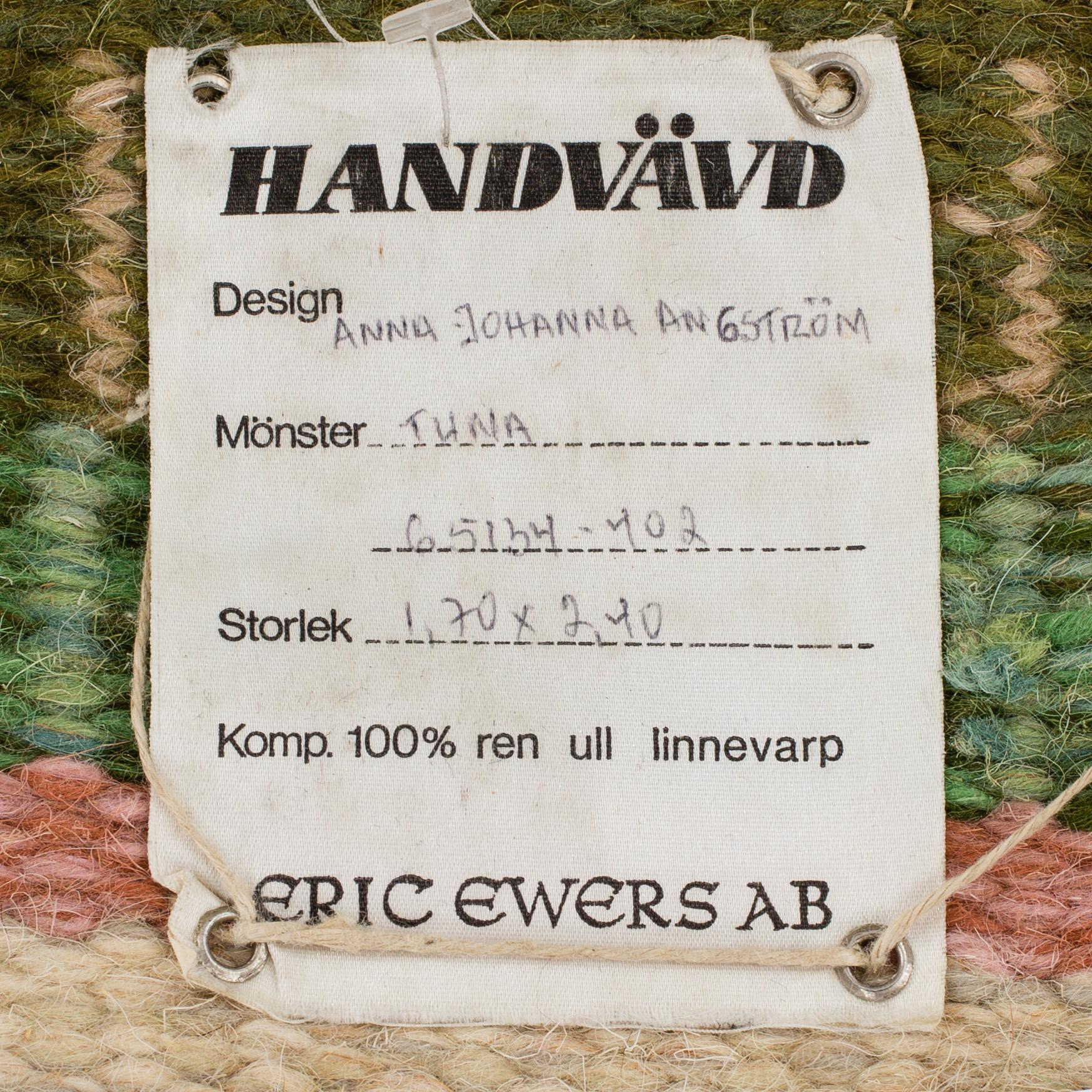 A CARPET, flat weave, ca 247 x 167,5 cm, signed AJA.