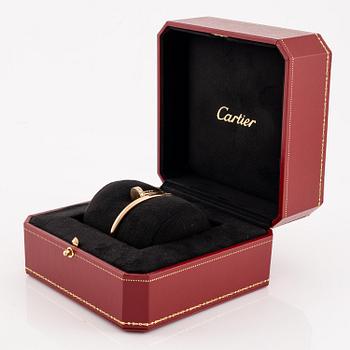 A Cartier bracelet "Juste un clou" in 18K rose gold with round brilliant-cut diamonds.