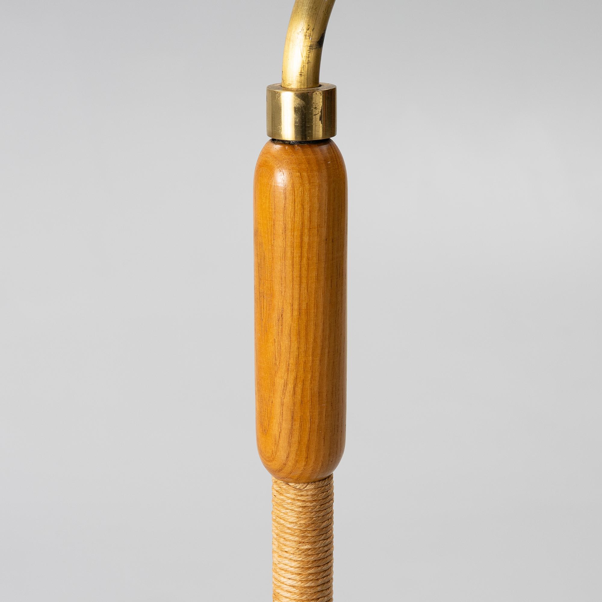 A 1940s Swedish Modern floor lamp.