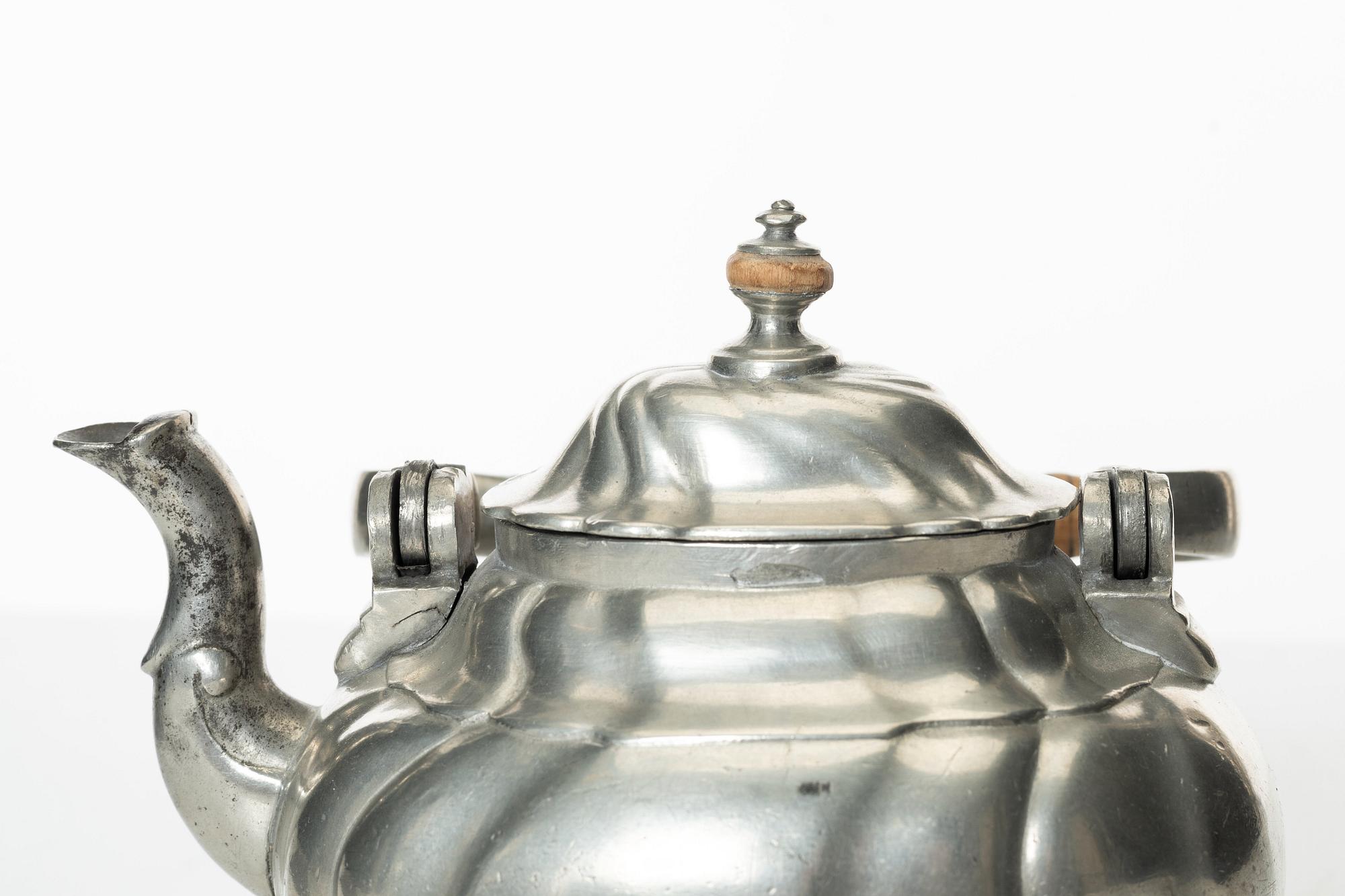 A Rococo pewter teapotby P J Mattsson 1808.