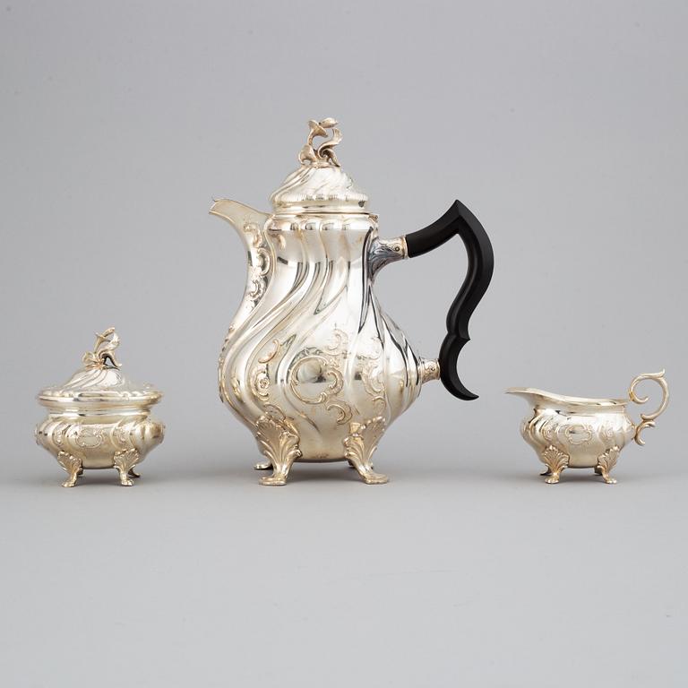 CG Hallberg, a silver coffee pot, creamer and sugar bowl, Stockholm 1956-57.