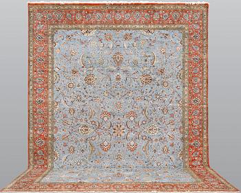A Ghom carpet, part silk, approx. 480 x 350 cm.