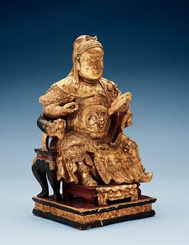 1702. A wooden, gilt and lacquered figure of an chinese general, Qing dynasty, presumably Qianlong (1736-95).