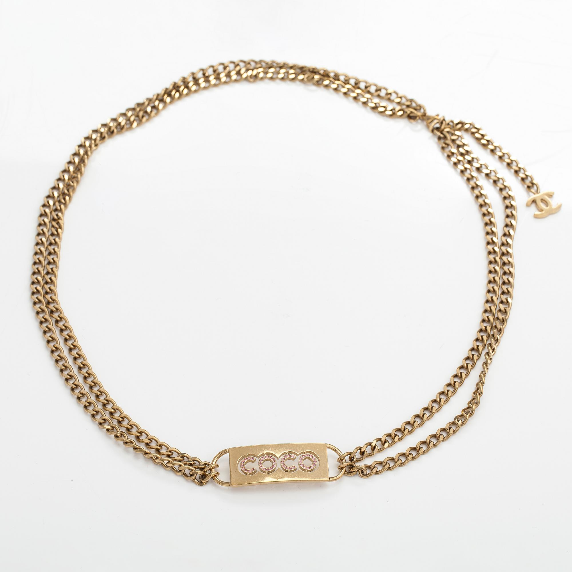 Chanel, A gold coloured metal chain belt with pink stones. Marked "CHANEL 02 CC P MADE IN ITALY".