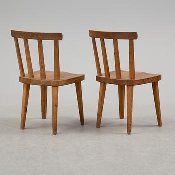 A pair of "Utö" pinewood chairs by Axel Einar Hjorth in the 1930's.
