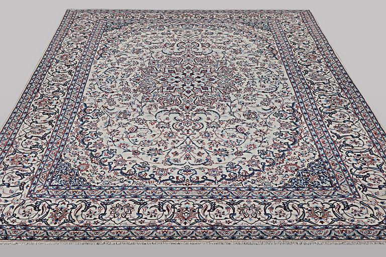 A carpet, Nain, part silk, ca 426 x 309 cm.