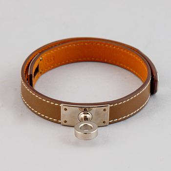 Hermès, a taupe leather 'Kelly Double' bracelet, size XS, 2013.