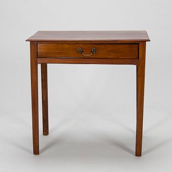 An early 19th-century wooden side table, possibly England.