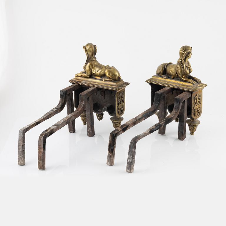 A pair of French 19th century bronze fire dogs.