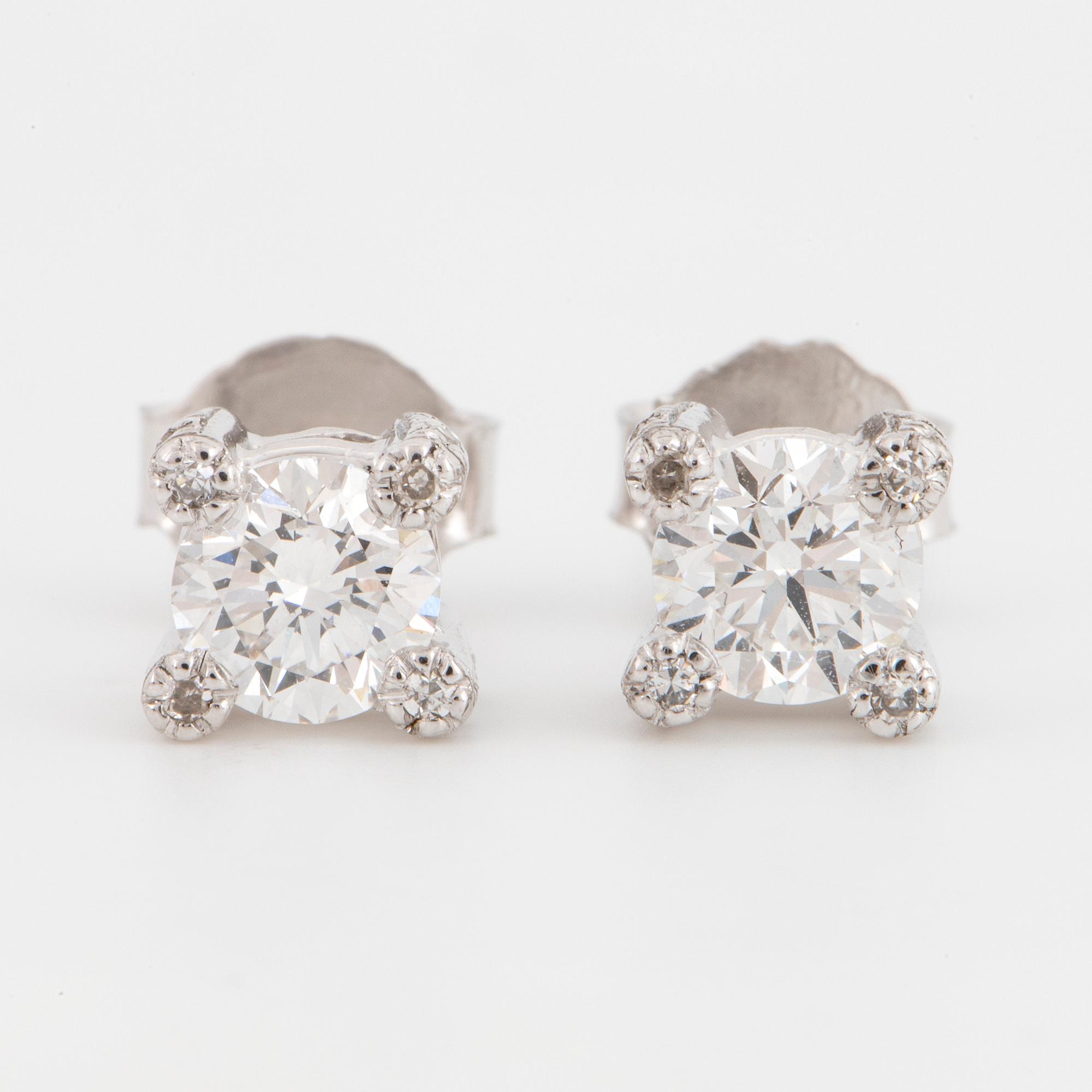 Brilliant-cut diamond stud earrings.