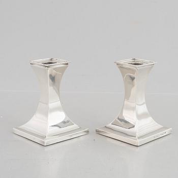 A pair of silver candlesticks, mark of William Hutton & Sons Ltd, Sheffield 1911-1912.