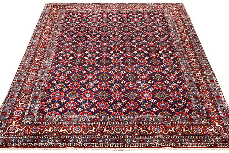 A semi-antique Vermain carpet, c. 339 x 233 cm.