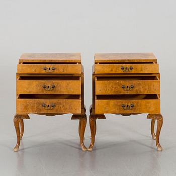 A pair of Rococo-style bedside tables.