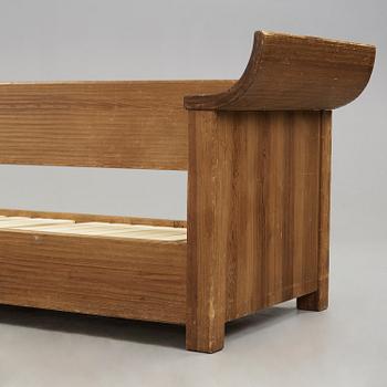An Axel Einar Hjorth stained pine sofa 'Sandhamn', Nordiska Kompaniet 1933.