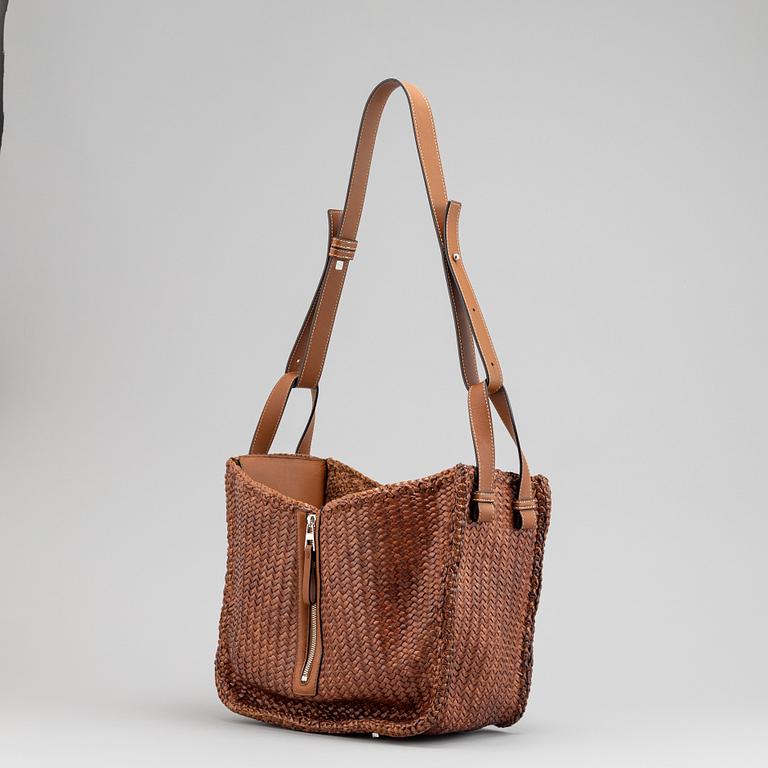 Loewe, a brown woven leather handbag.
