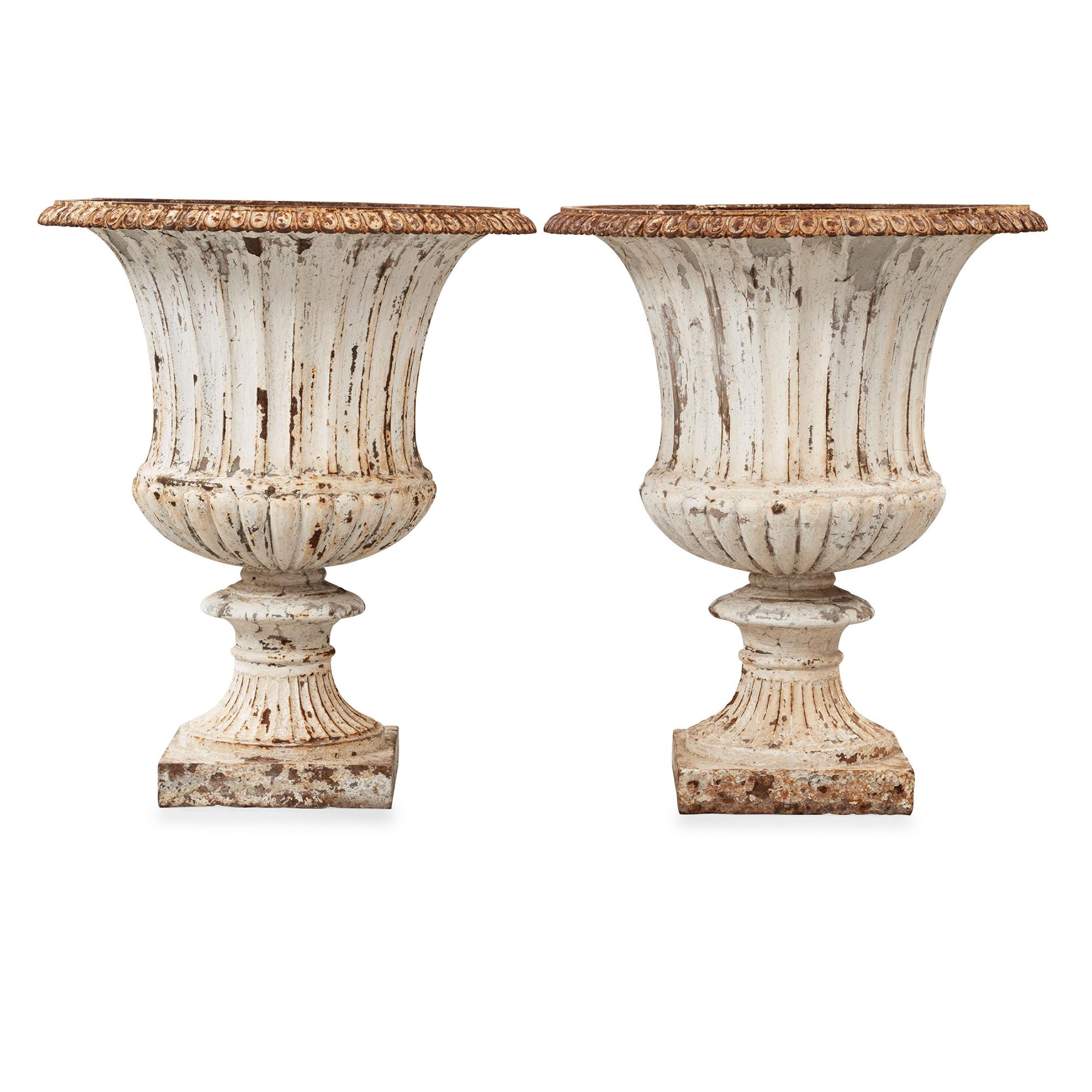 A pair of English 1860's iron garden urns.