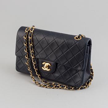 Chanel, a navy leather 'Double Flap Bag', 1989-91.