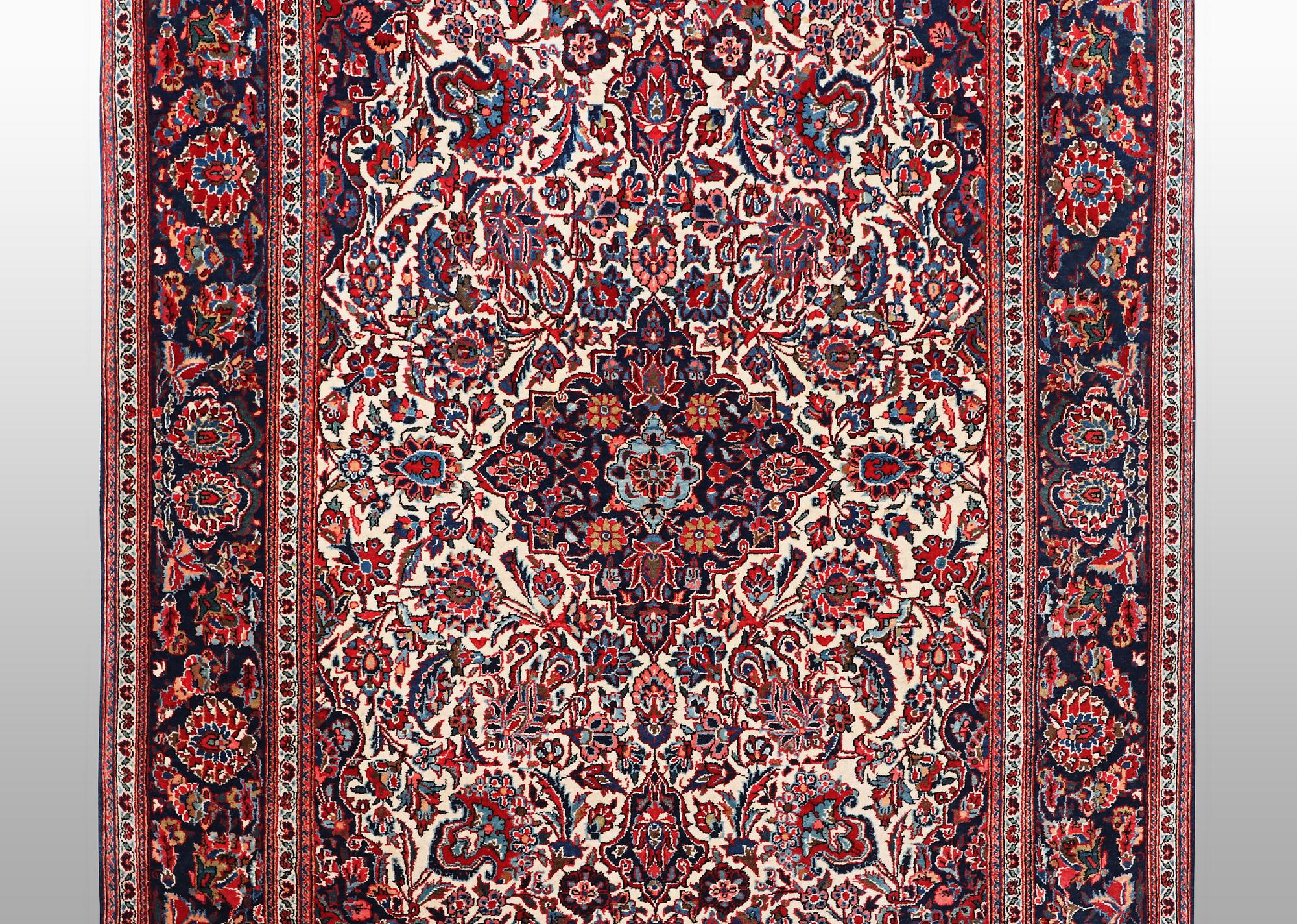 A rug, semi-antique Keshan, 217 x 134 cm.