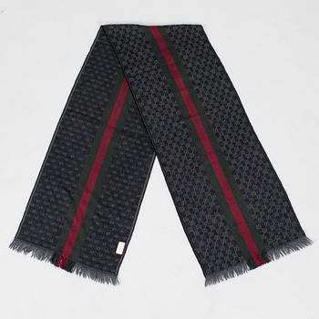 Gucci, A 'Verbier' scarf and a belt.