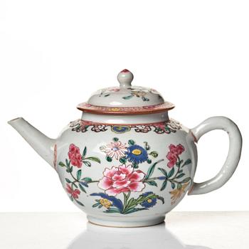 A famille rose tea pot with cover and cups with stand, Qing dynasty, 18th Century.