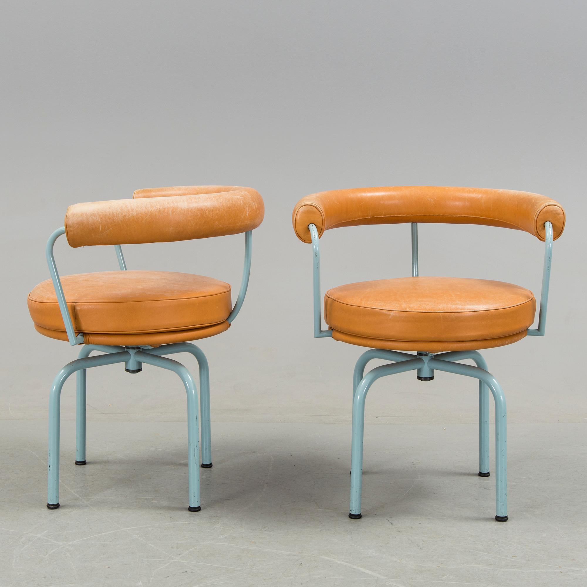 A set of four "LC7" chairs by Le Corbusier, Pierre Jeanneret and Charlotte Perriand for Cassina.