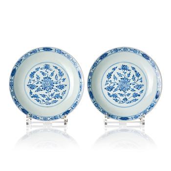 965. A pair of blue and white lotus dishes, Qing dynasty, Qianlong seal mark and of the period (1736-95).