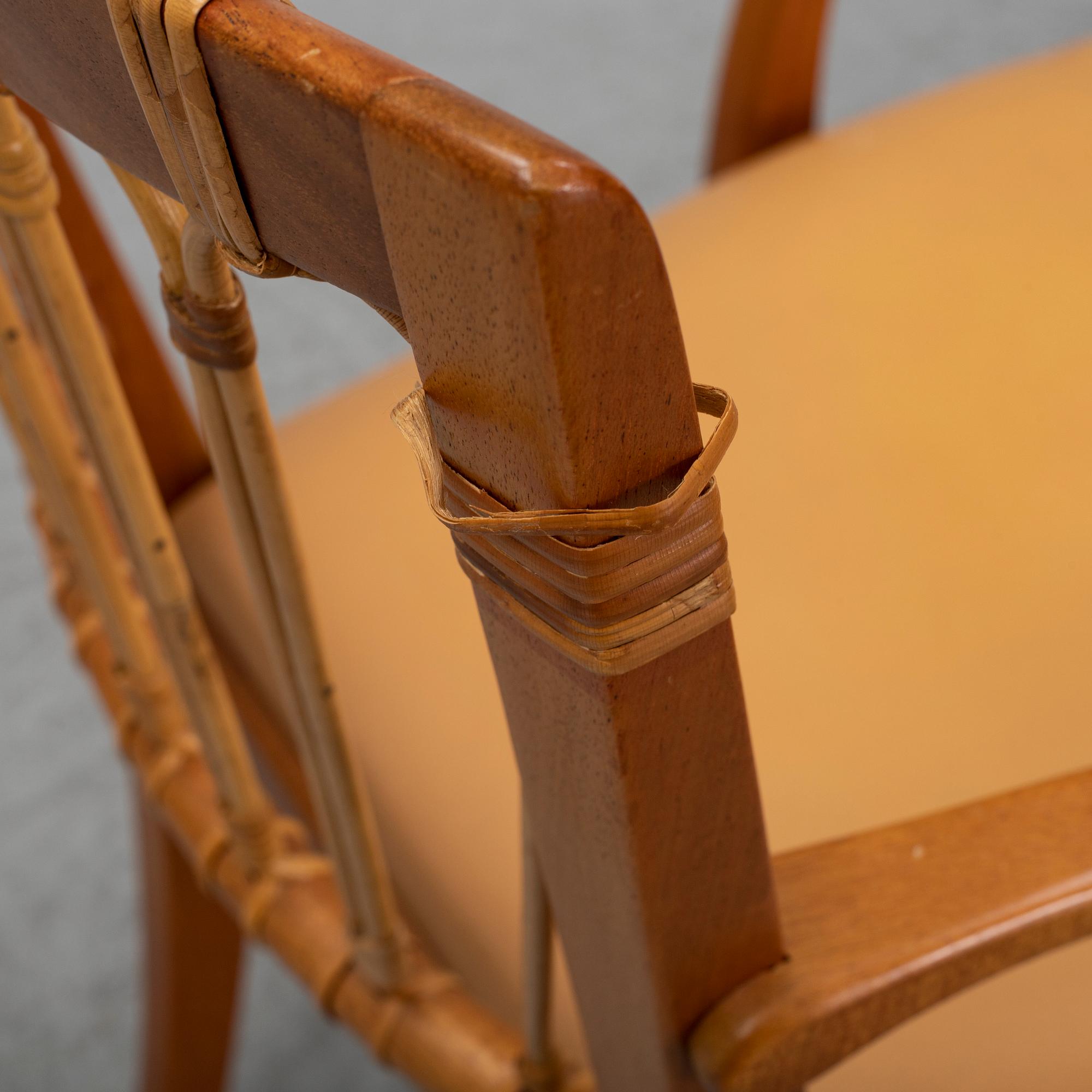 A pair of Josef Frank mahogany and rattan armchairs, Svenskt Tenn, Stockholm, Sweden.