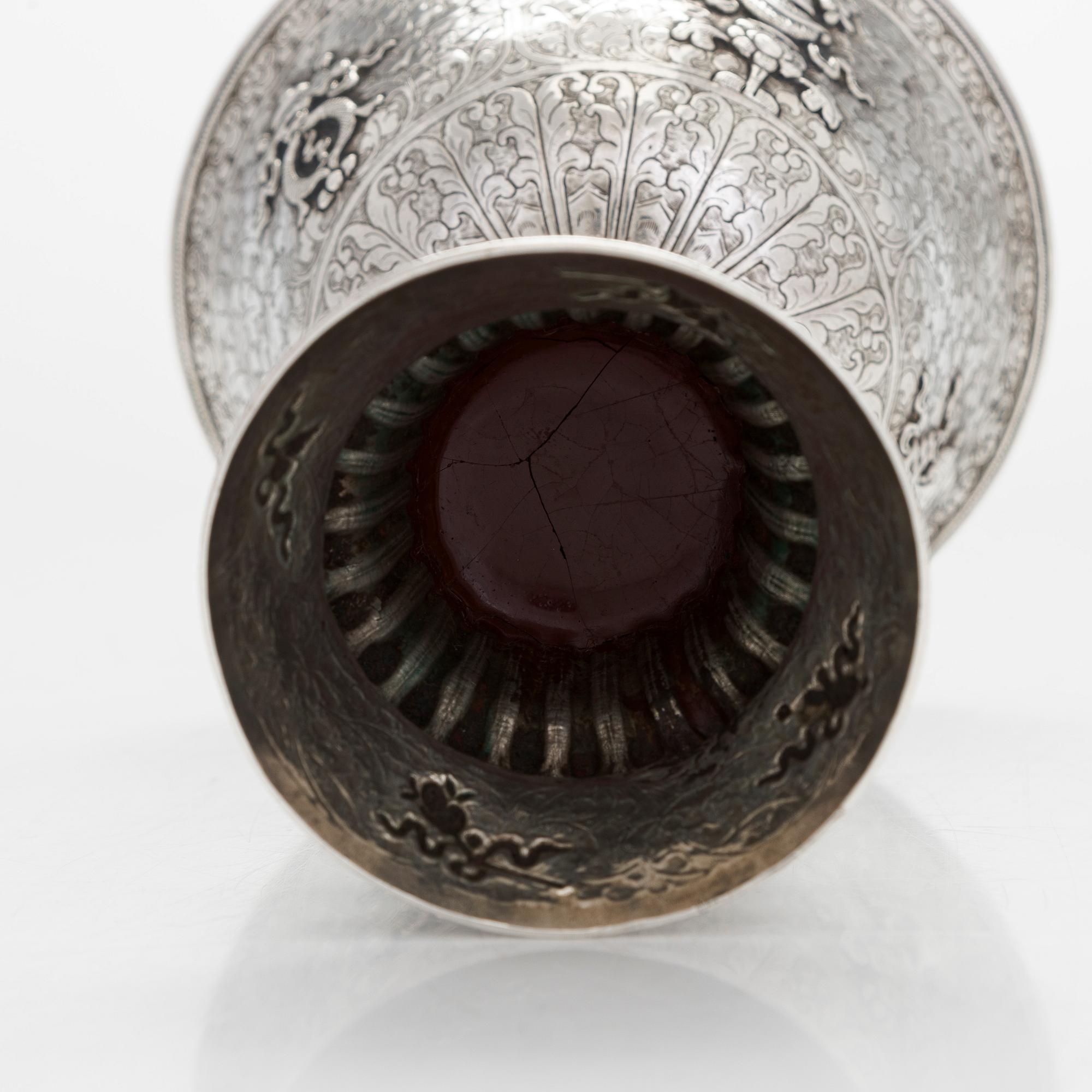A Tibetan butter lamp, silver, early 19th century.