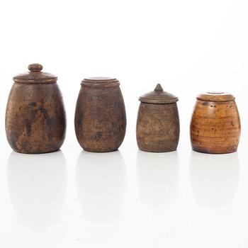 A set of four turned folk art jars, 19th century.