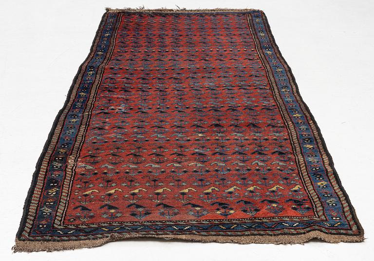 A runner carpet, antique Kurdish possibly, c. 280 x 112 cm.